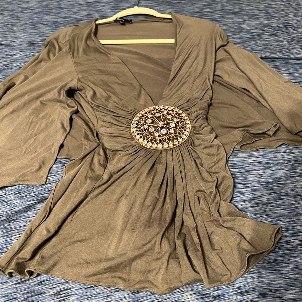 Olive colored Sky top with crystal medallion.